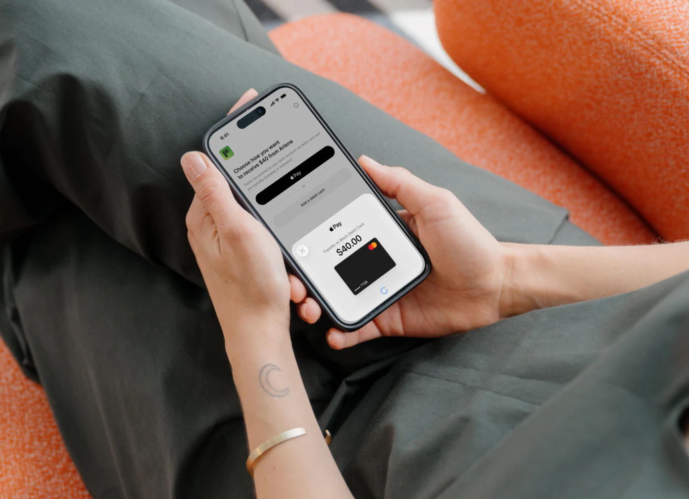 A person receiving $40 from Arlene to a debit card through Apple Pay.